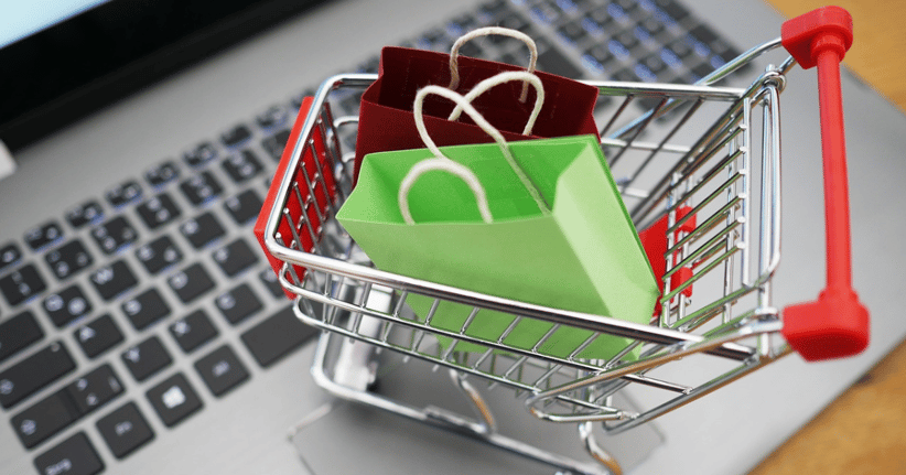 Mini shopping cart on laptop 