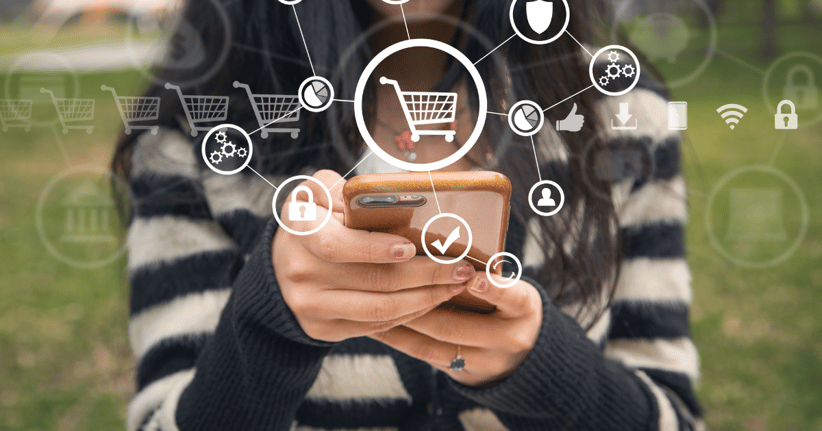 person holding cell phone with shopping icons overlayed